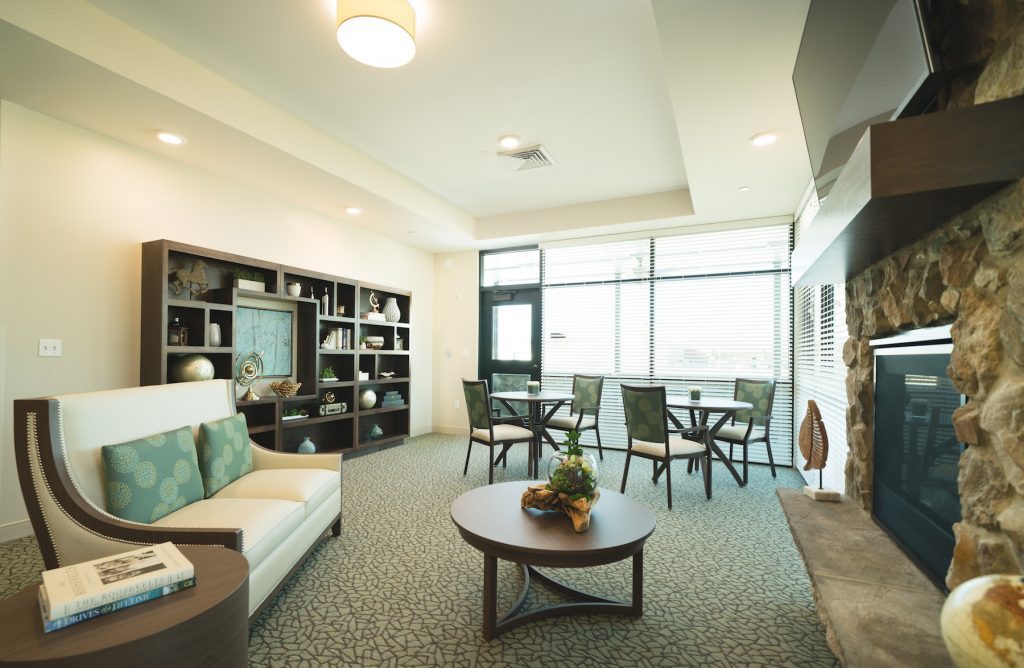 a common area with a fireplace that is used for patients that need short term care