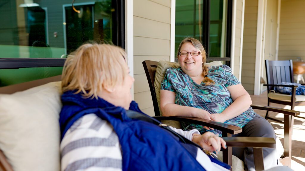 A family member speaks to a patient at BirchPointe, skilled nursing facility